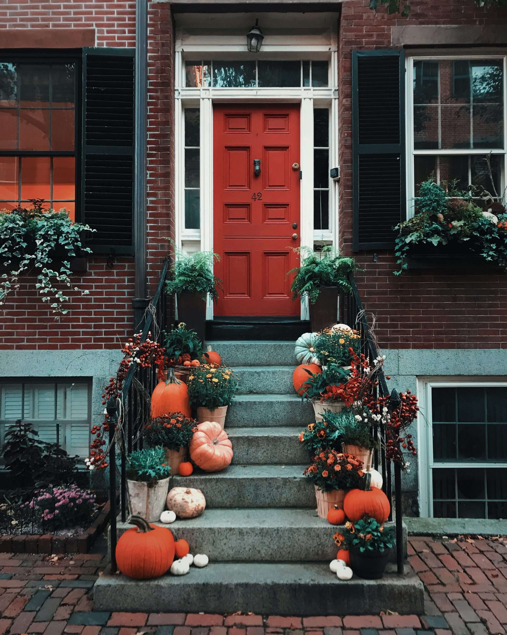 Fall decorations enhance your home entrance that welcomes friends and family.