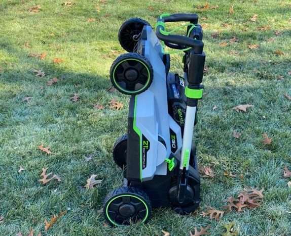 EGO Mower collapses down for winter storage. It's light enough to hang on a wall.